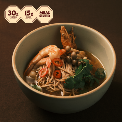 Bowl of Thai shrimp tom yum ramen with shrimp, red chili and cilantro; 30g protein, 15g fiber, meal sized