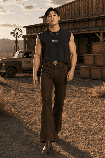 Person in a black Kyunu tank top and brown flares walking past a vintage Kyunu Noodle Co. truck