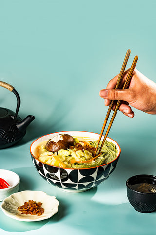 Tablescape of KYUNU Creamy Vegan Chamon Protein Ramen Kit with condiments