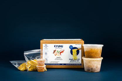 KYUNU Danzai Protein Hand Pulled Noodle Kit Package Contents with two noodle packs, two soups, and to sets of toppings