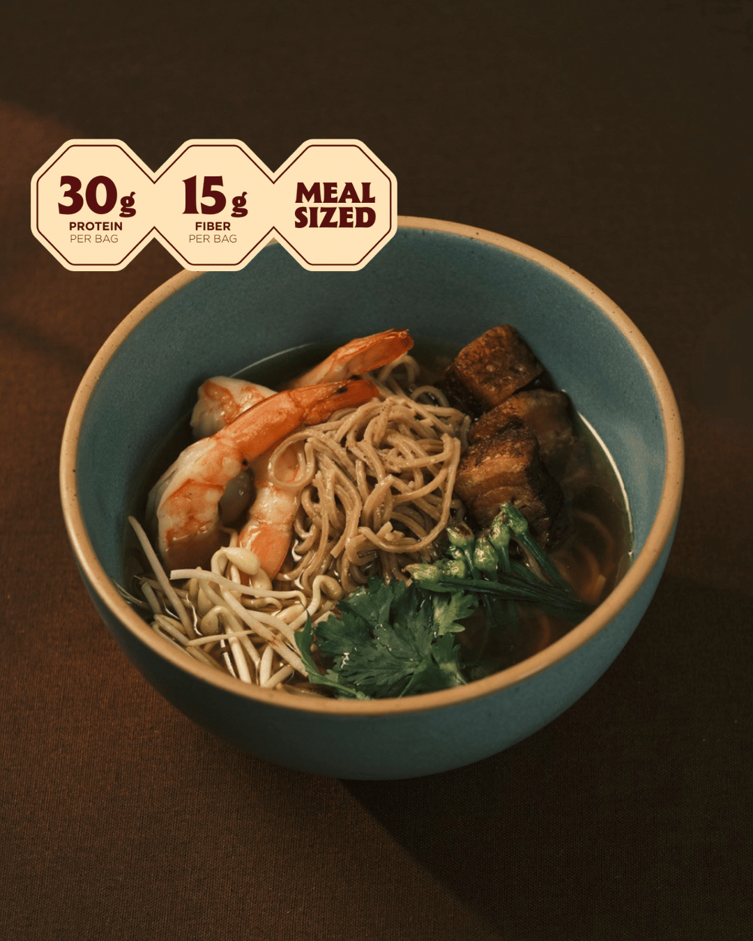 Bowl of pork and shrimp danzai ramen with shrimp, braised pork belly and bean sprouts; 30g protein, meal sized